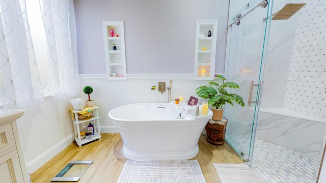 bathroom featuring independent shower and bath and hardwood / wood-style flooring