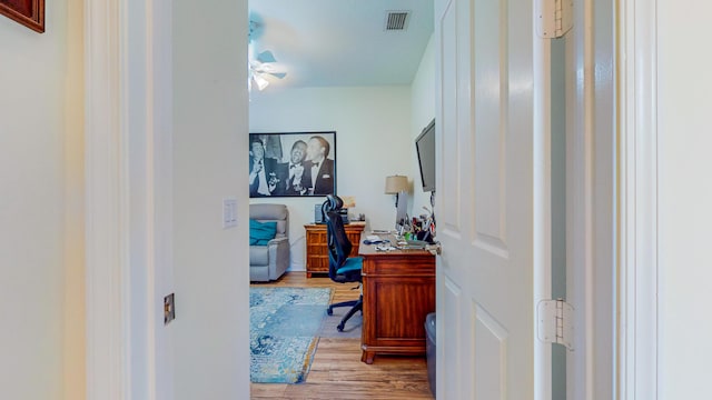 office space with ceiling fan and light wood-type flooring