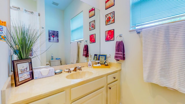 bathroom with vanity and toilet