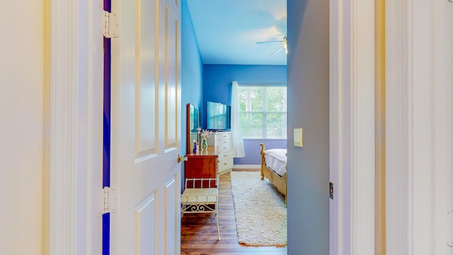 bathroom featuring wood-type flooring, a textured ceiling, and ceiling fan