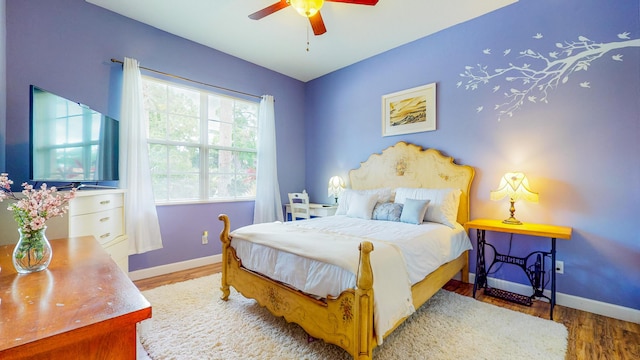 bedroom featuring ceiling fan and wood-type flooring