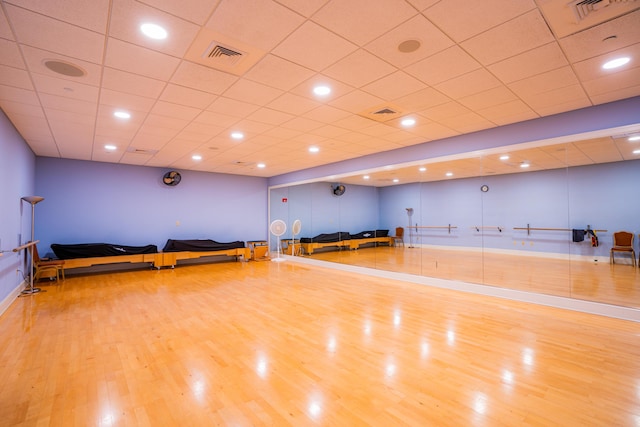 workout area featuring light hardwood / wood-style floors