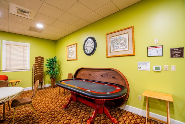 game room with carpet flooring and a drop ceiling