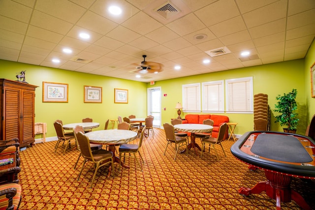 dining room featuring light colored carpet and ceiling fan