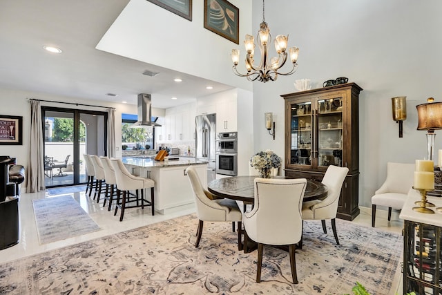 dining space featuring wine cooler and an inviting chandelier