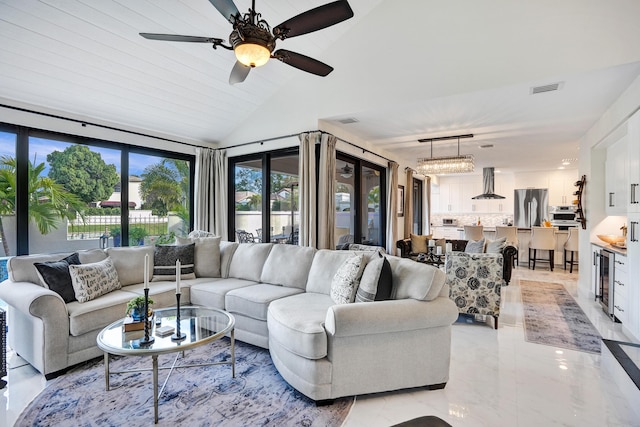 living room with ceiling fan, wood ceiling, and vaulted ceiling