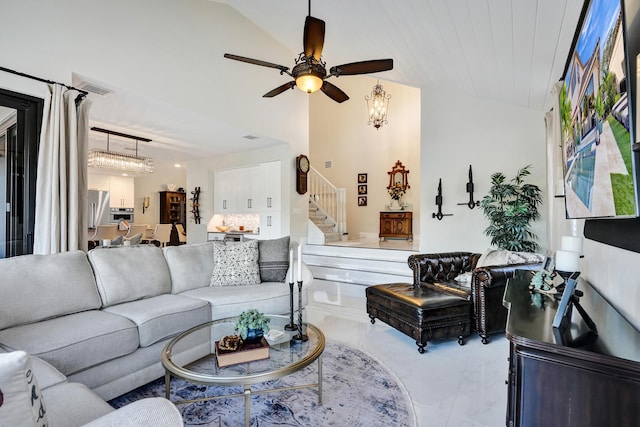 living room with ceiling fan and lofted ceiling