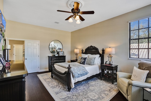 bedroom featuring ceiling fan and dark hardwood / wood-style floors