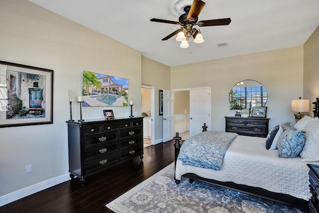 bedroom with ceiling fan and dark hardwood / wood-style flooring