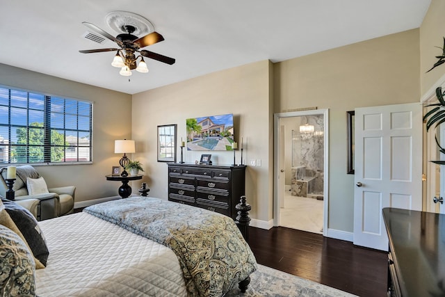 bedroom featuring ensuite bath, ceiling fan, and dark hardwood / wood-style floors