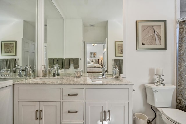 bathroom with vanity and toilet