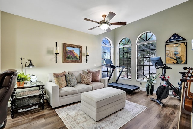 living room featuring hardwood / wood-style floors and ceiling fan