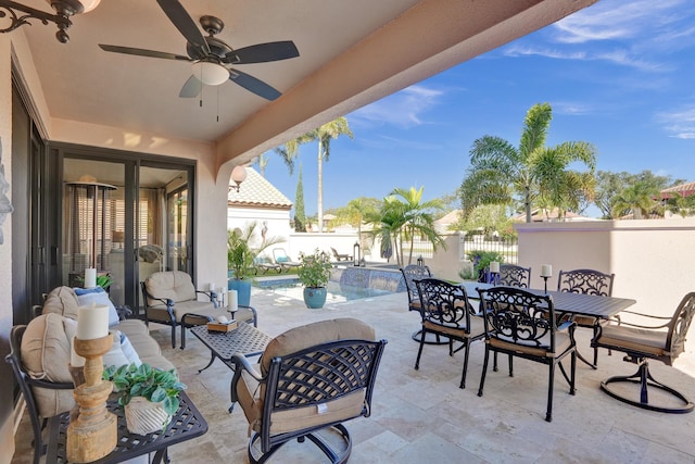 view of patio / terrace featuring a fenced in pool and ceiling fan