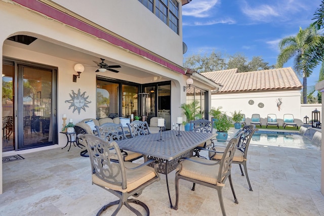 view of patio with pool water feature and ceiling fan