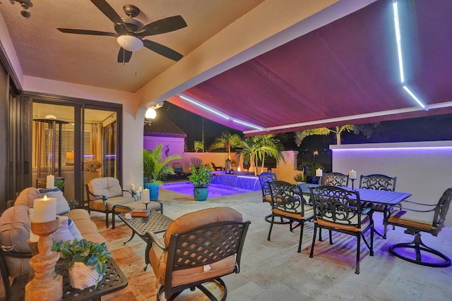 view of patio featuring ceiling fan