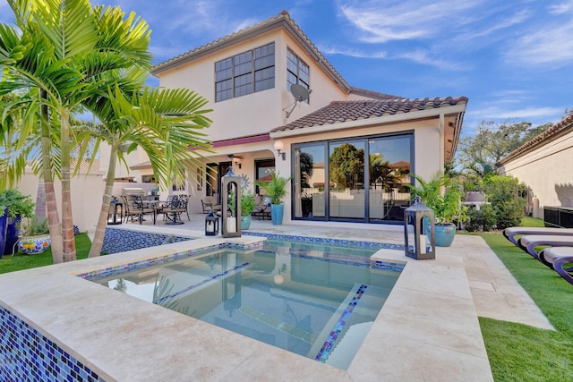 view of pool with a patio area and a hot tub