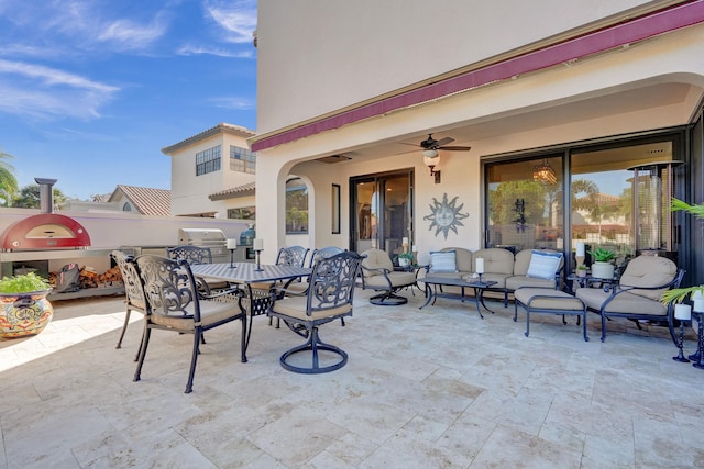 view of patio featuring ceiling fan and an outdoor living space