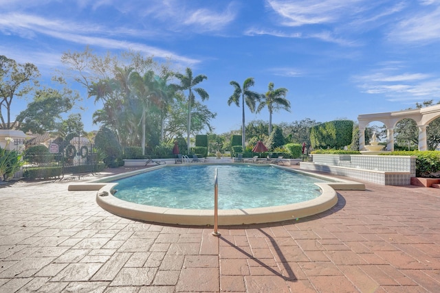 view of swimming pool with a patio area