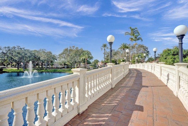 view of community with a water view