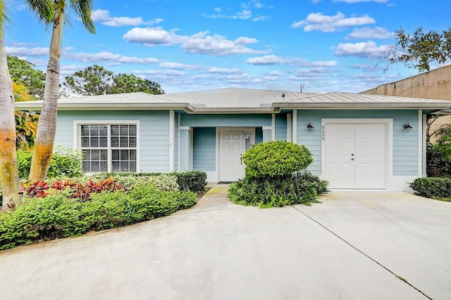 single story home featuring a garage