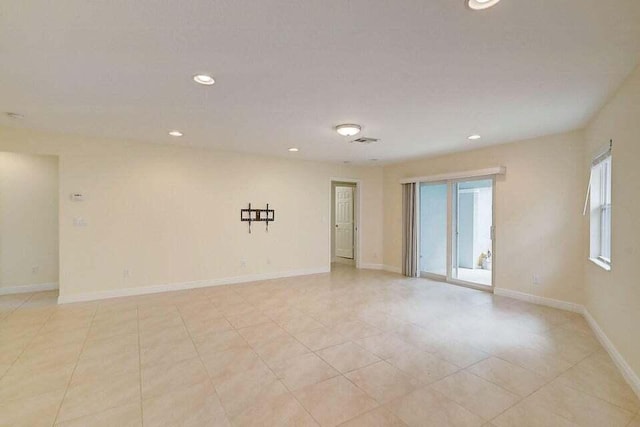 empty room featuring light tile patterned floors