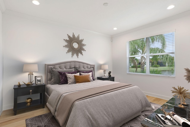 bedroom featuring light wood-type flooring and ornamental molding