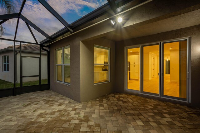 view of patio terrace at dusk