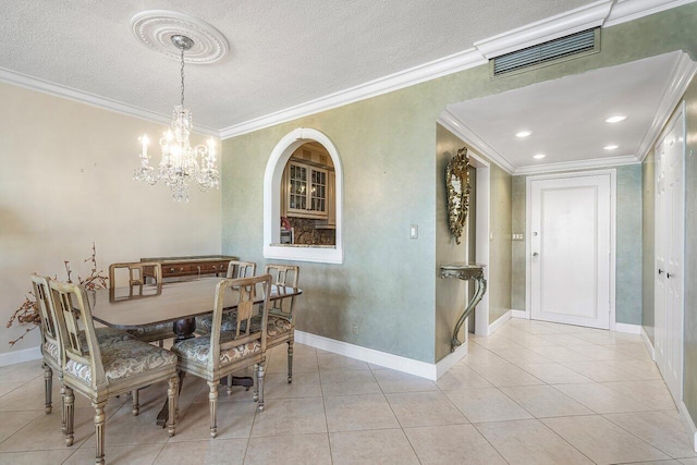 tiled dining room featuring a notable chandelier and crown molding