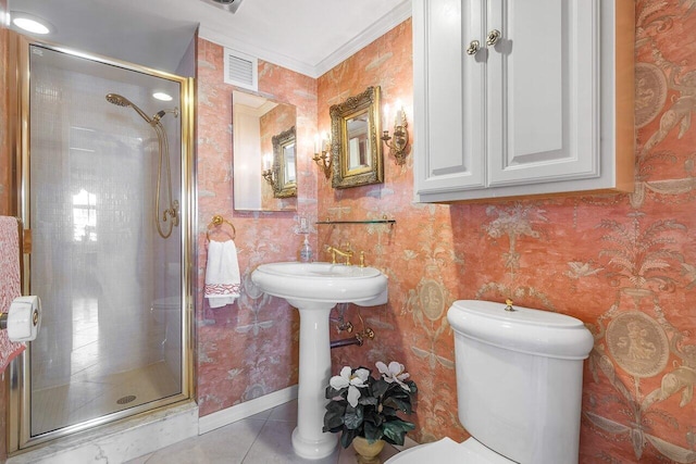 bathroom featuring toilet, crown molding, tile patterned flooring, and walk in shower