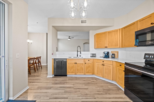 kitchen featuring light brown cabinetry, sink, light wood-type flooring, ceiling fan with notable chandelier, and black appliances