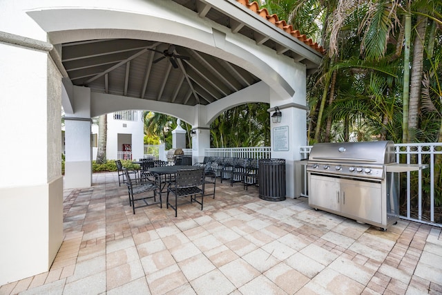 view of patio with a gazebo, ceiling fan, an outdoor kitchen, and area for grilling