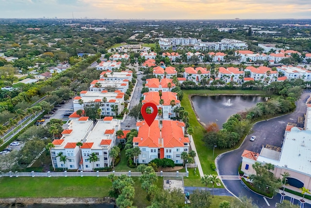 aerial view at dusk with a water view