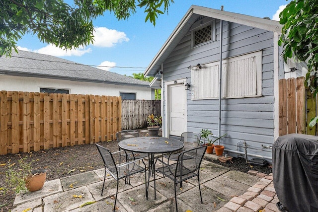 view of patio featuring a grill