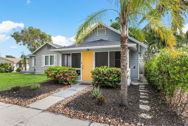 bungalow with a front yard