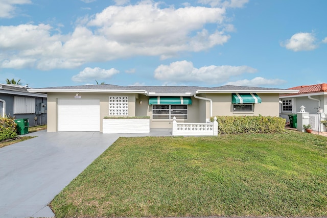 view of front of house featuring a garage and a front yard