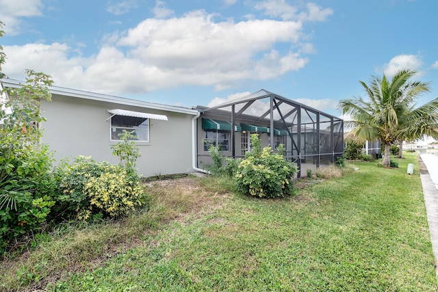 view of yard featuring a lanai