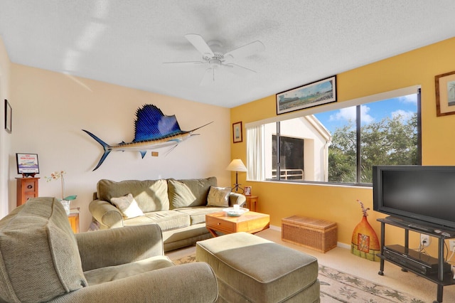 living room featuring a textured ceiling, ceiling fan, and light carpet