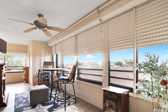 sunroom / solarium with ceiling fan