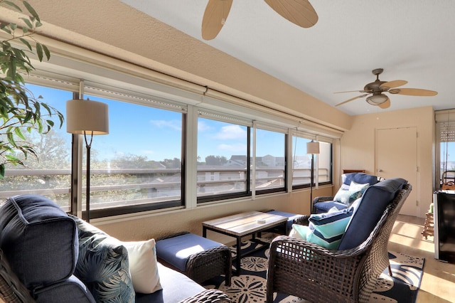 sunroom / solarium with a wealth of natural light and ceiling fan