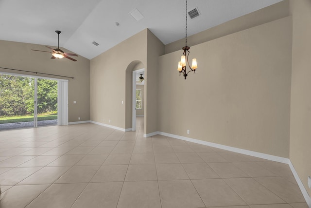 unfurnished room featuring visible vents, ceiling fan with notable chandelier, arched walkways, light tile patterned floors, and baseboards