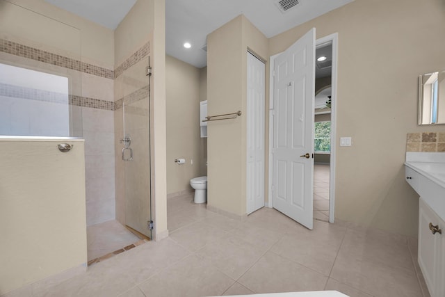 full bath with tile patterned floors, visible vents, toilet, a stall shower, and vanity