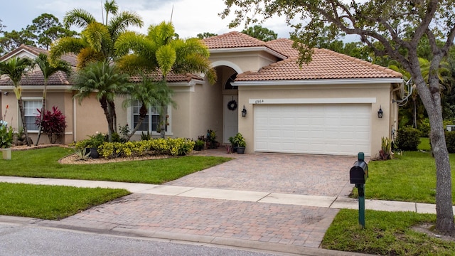 view of front of property with stucco siding, a front lawn, a garage, a tiled roof, and decorative driveway