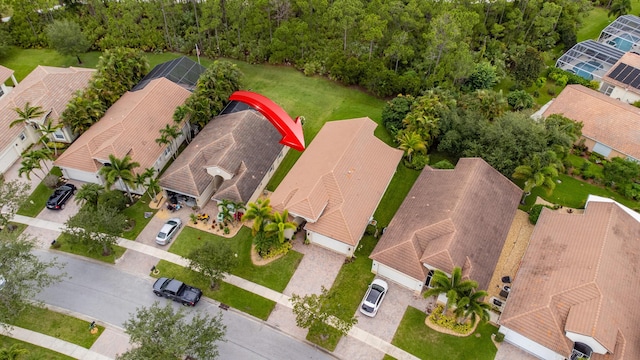 birds eye view of property with a residential view