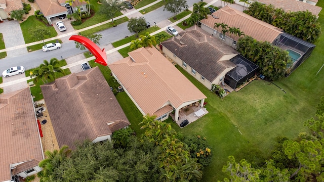 birds eye view of property with a residential view