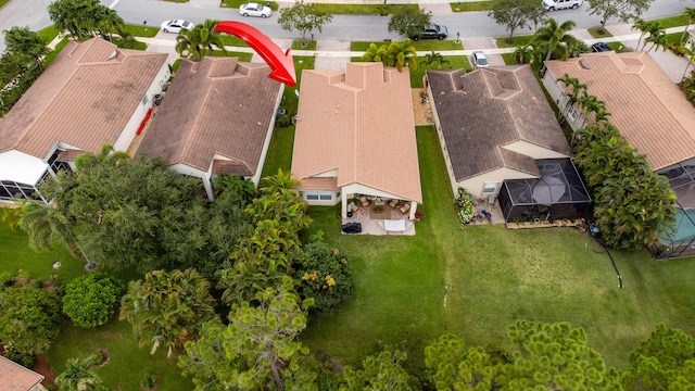 birds eye view of property with a residential view