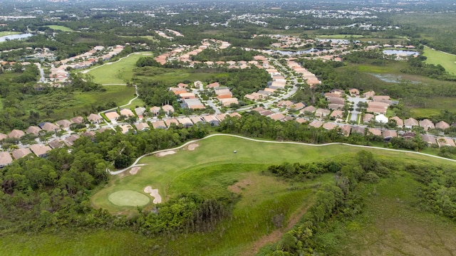 bird's eye view featuring a residential view, golf course view, and a water view