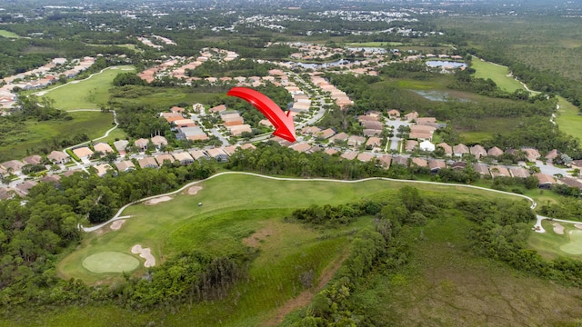 aerial view with a residential view and view of golf course