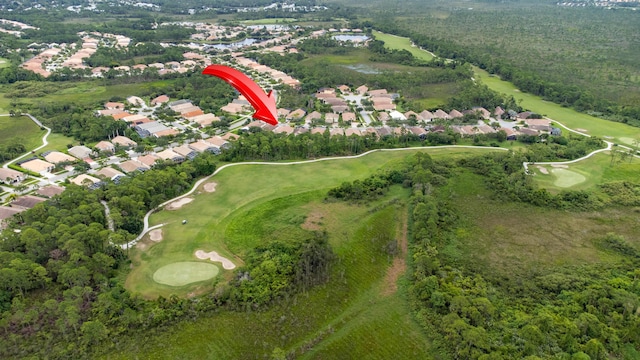 aerial view with a residential view and view of golf course