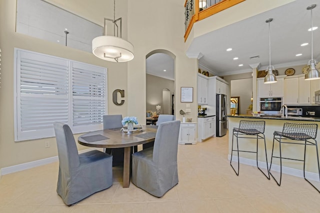 tiled dining space with crown molding