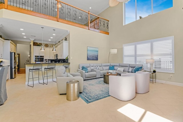 living room featuring light tile patterned floors and crown molding